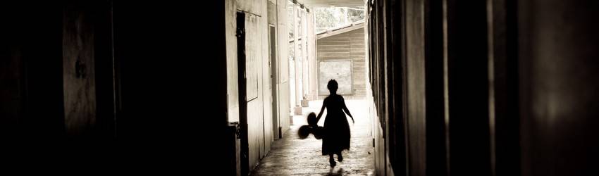 A woman is abandoned in a hallway in her dream.