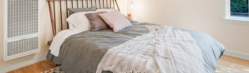 A made bed in a room.