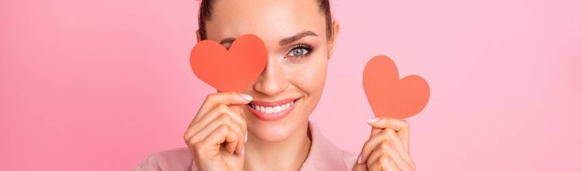 woman-holding-up-hearts